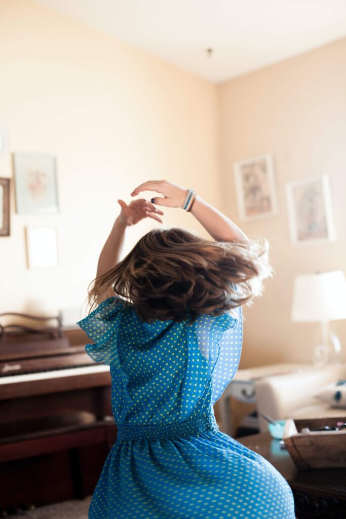 woman dancing  to music to help overcome the winter blues
