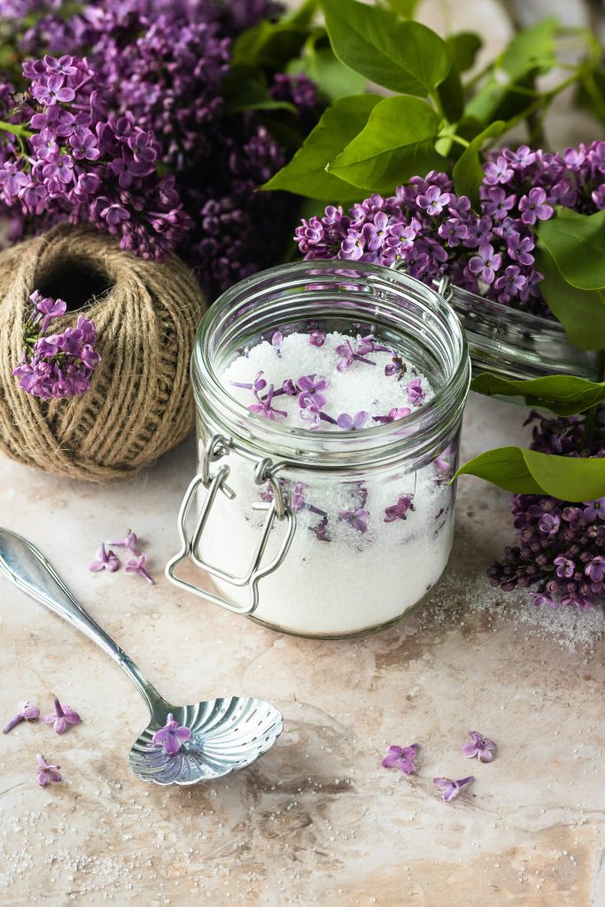 homemade self-care DIY foot scrub in glass jar for relaxing at-home spa treatment