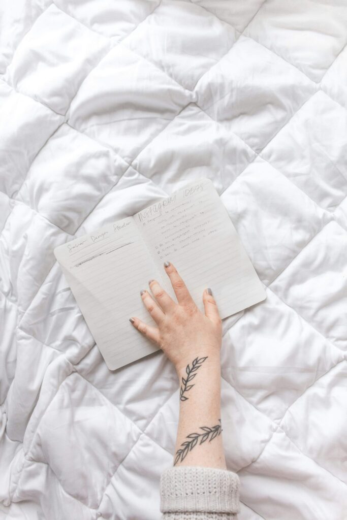 journal symbolizing progress over perfection in a self-love journey.
