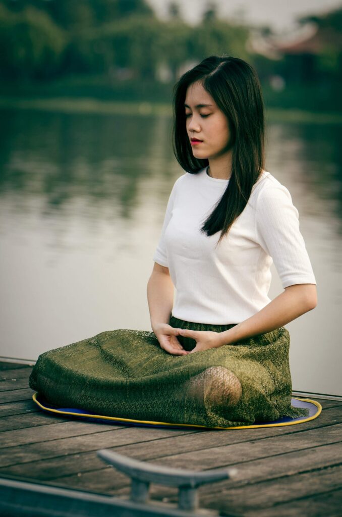 Woman practicing m meditation and rest to improve focus and mental clarity as part of mental spring cleaning