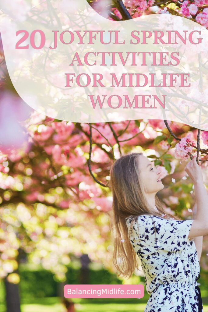 midlife woman enjoying spring tree blossoms