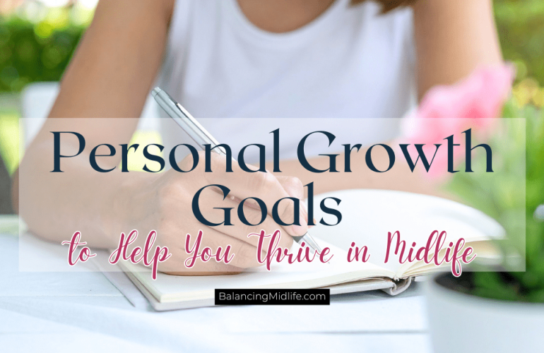 Woman journaling reflecting on personal growth goals in midlife