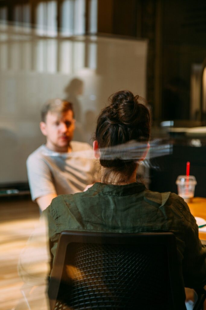 man and woman talking. Relationships can be a common cause of stress in women