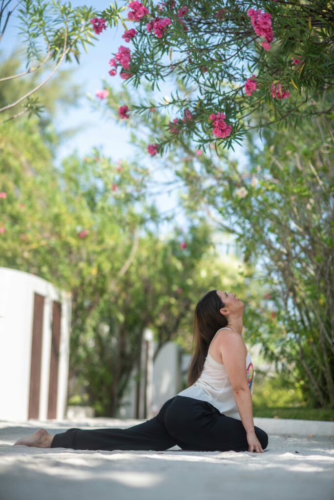 woman stretching outdoors, practicing self-care making time for herself