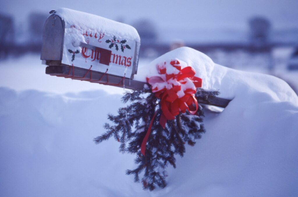 Merry Christmas on mailbox in snow