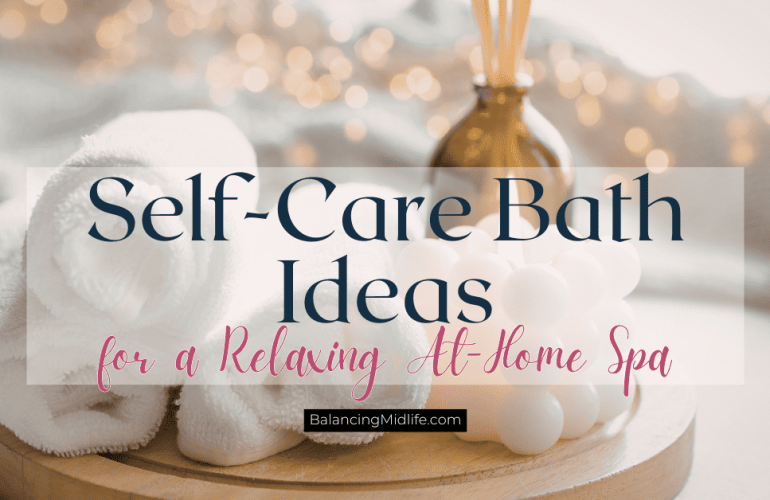 cozy at-home bath set up with towels, essential oils, and other items for relaxing self-care