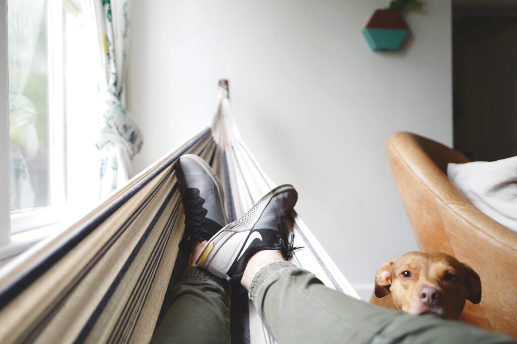 man in a hammock/ practicing self-care