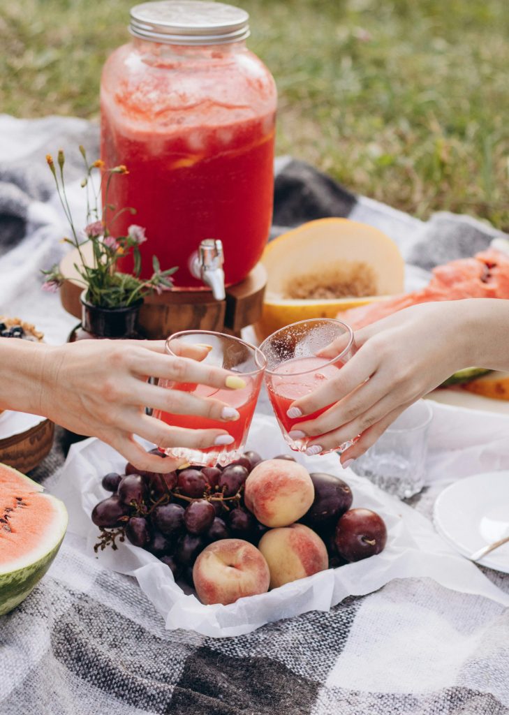 Summer bucket list ideas for families enjoying a picnic and quality time together