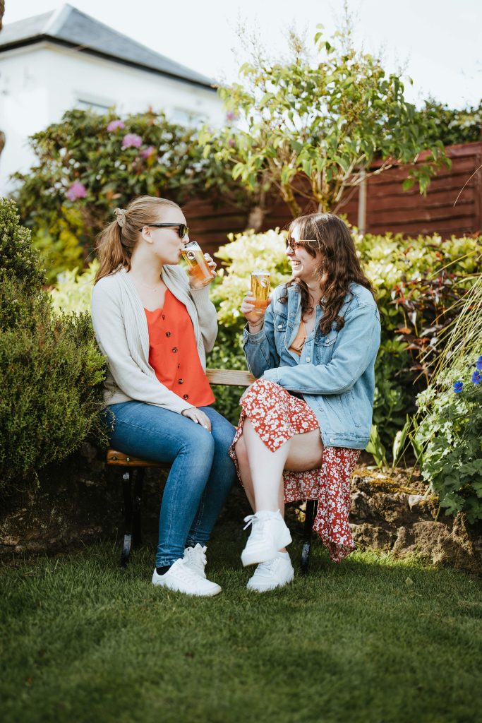 Two midlife women spending time together and enjoying meaningful connection as part of social wellness.