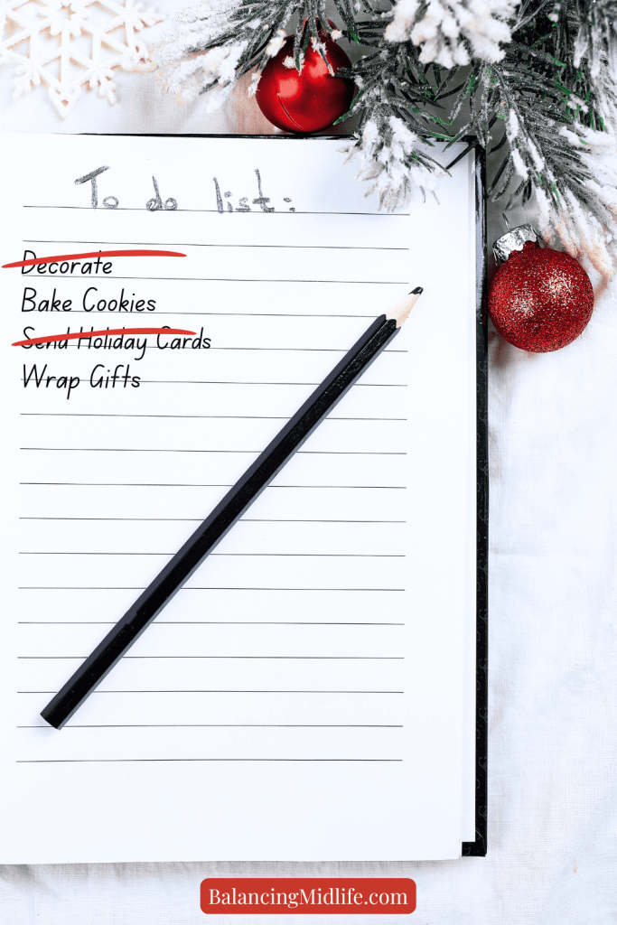 Simple holiday to-do list with tasks crossed off and seasonal greenery