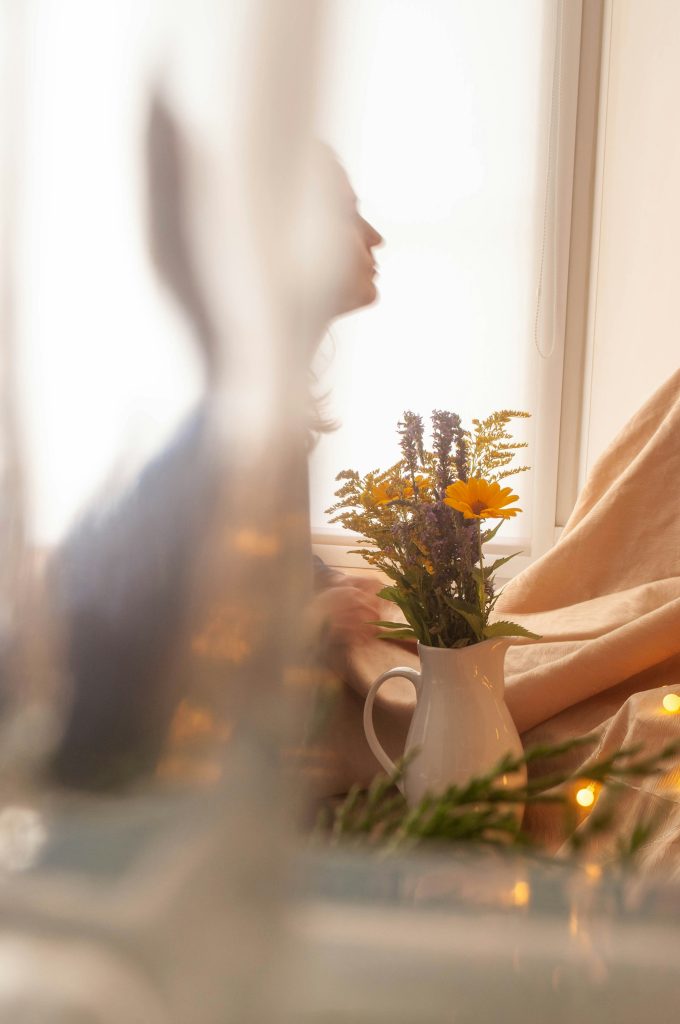 Midlife woman practicing simple self-care for mental health with a quiet morning moment