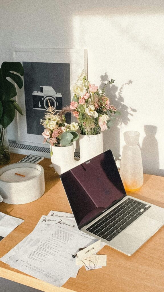 Organized workspace showing planner and laptop, reflecting setting