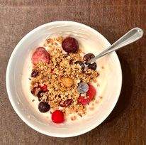 granola with yogurt and berries in a bowl