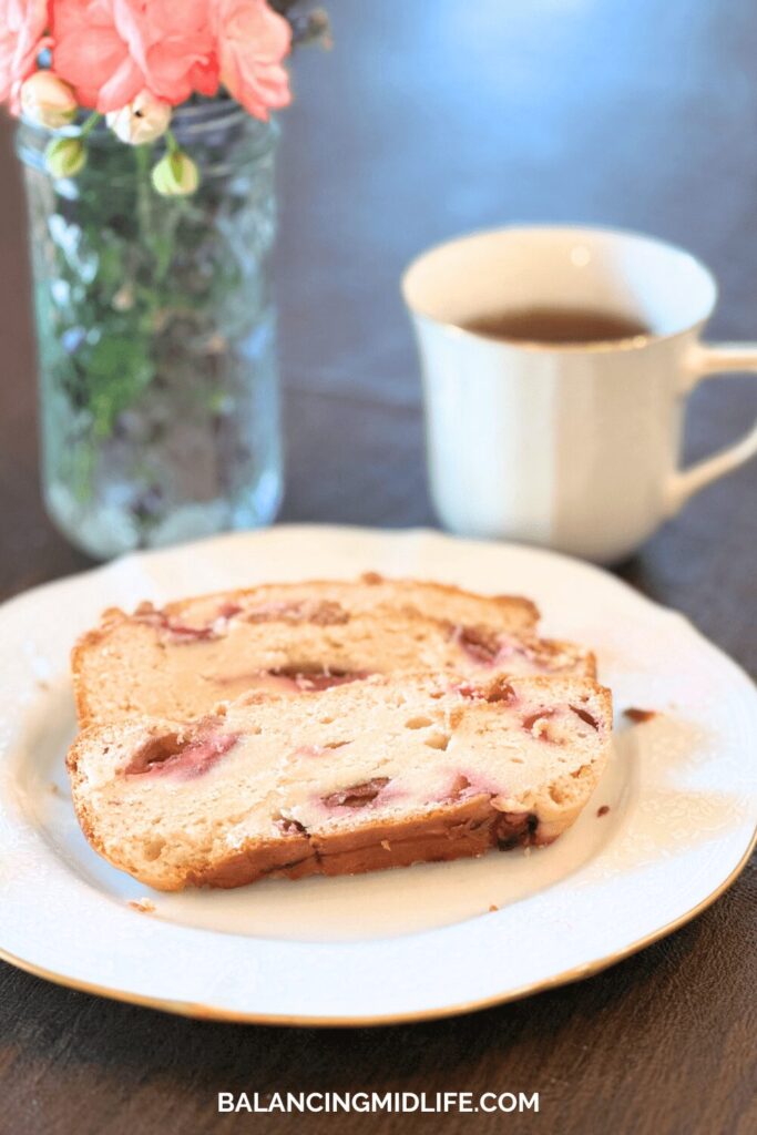 bread, flowers and cup of tea