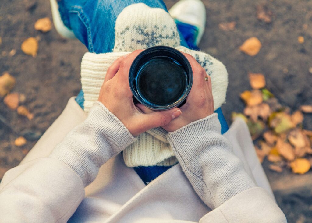 woman holding a cup of coffee