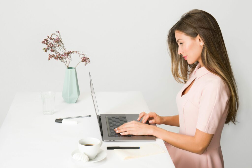 Woman using a time block planner for productivity and focus
