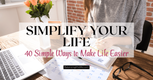 Woman sitting at a table in a comfortable home with a notebook and coffee, representing a simplify your life checklist with simple ways to make life easier.